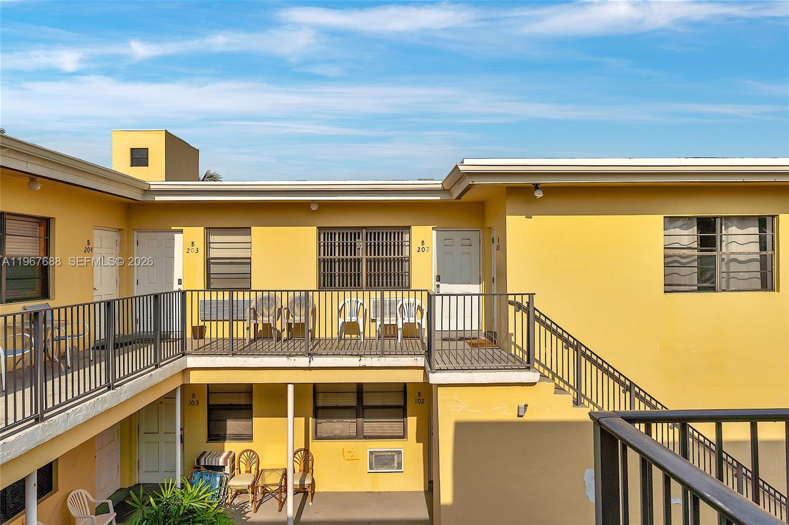 322 Harding Street, Unit B202 Hollywood, FL 33019 - Photo 17 of 39 a front view of a building with a ocean view
