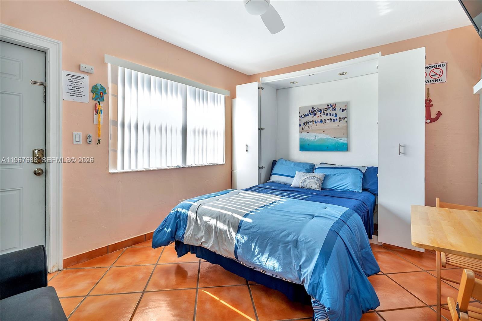 322 Harding Street, Unit B202 Hollywood, FL 33019 - Photo 23 of 39 a bedroom with a bed and a window