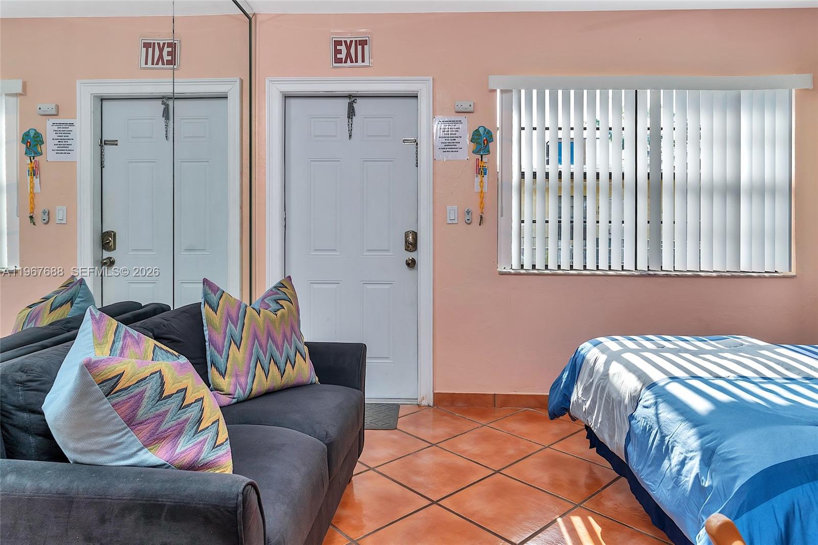 322 Harding Street, Unit B202 Hollywood, FL 33019 - Photo 26 of 39 a bedroom with a bed and couch