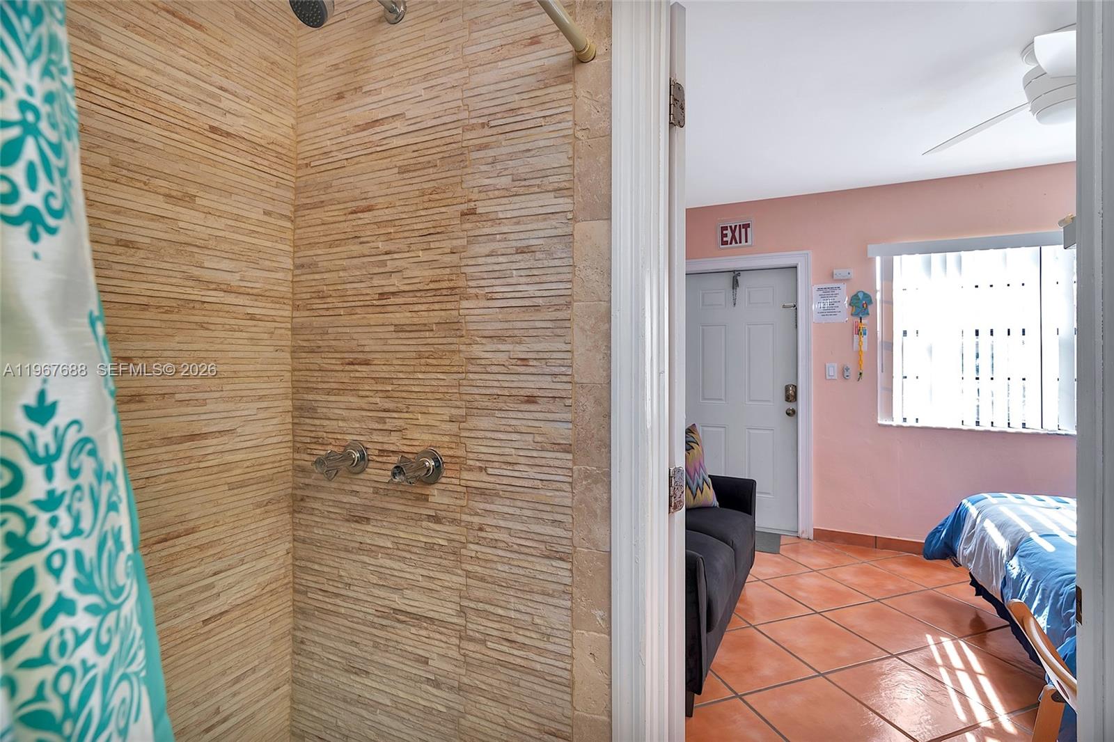 322 Harding Street, Unit B202 Hollywood, FL 33019 - Photo 28 of 39 a bathroom with a tub and a shower