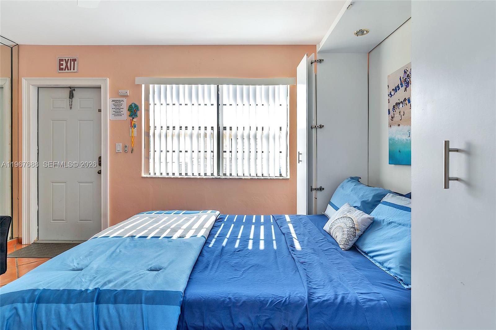 322 Harding Street, Unit B202 Hollywood, FL 33019 - Photo 31 of 39 a bedroom with a large bed and a window