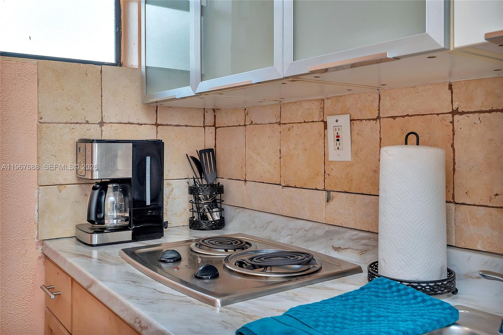 322 Harding Street, Unit B202 Hollywood, FL 33019 - Photo 35 of 39 a kitchen with a refrigerator and a stove