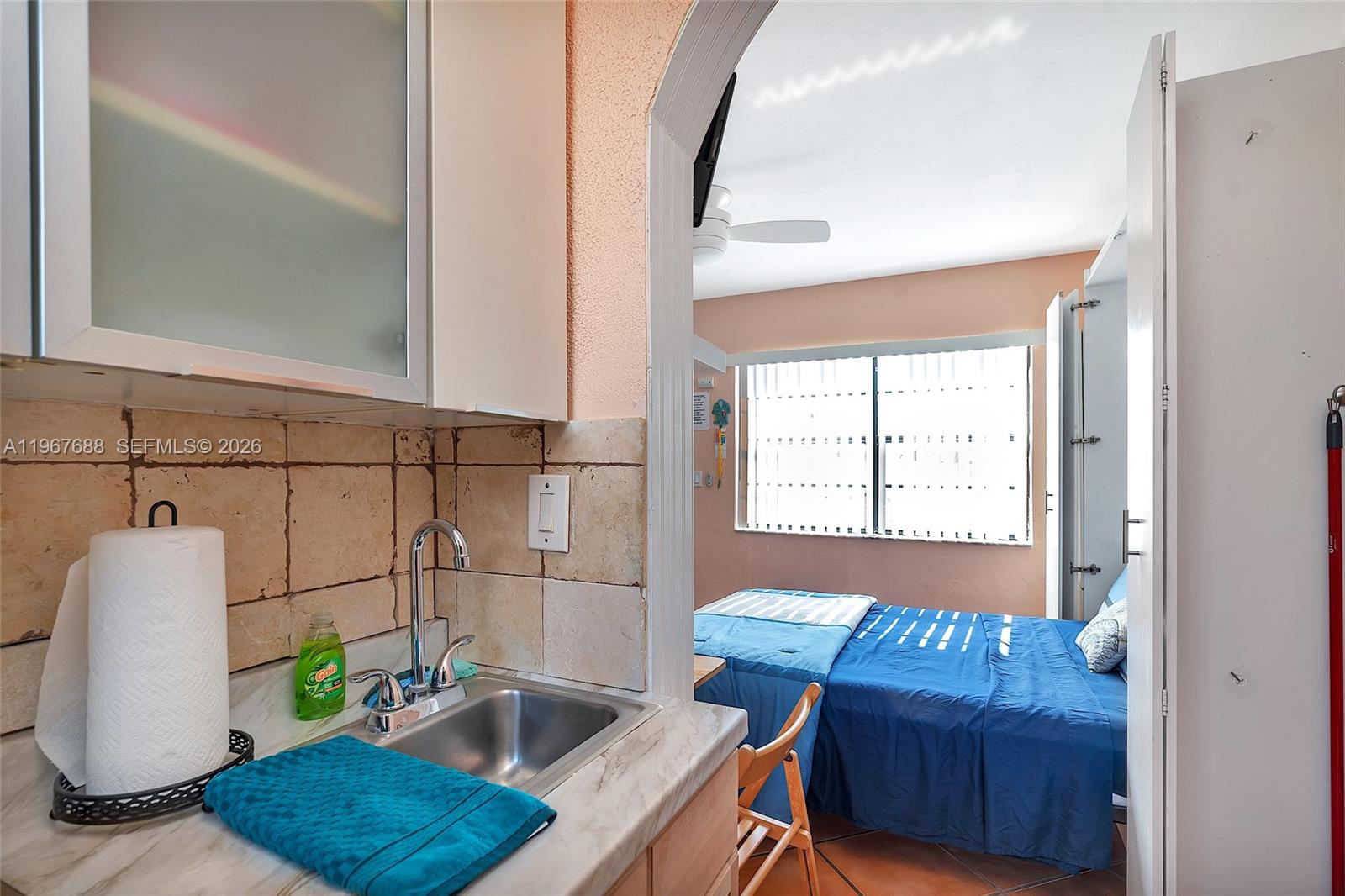 322 Harding Street, Unit B202 Hollywood, FL 33019 - Photo 36 of 39 a bathroom with a sink and a mirror