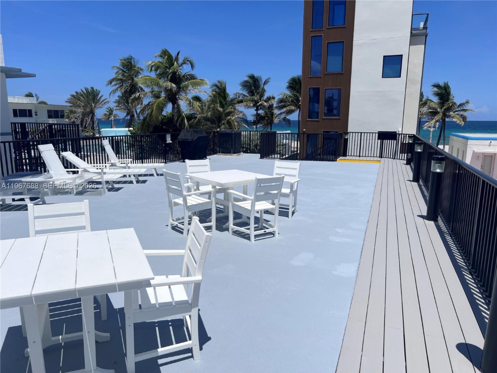 322 Harding Street, Unit B202 Hollywood, FL 33019 - Photo 38 of 39 a view of a kitchen with a table and chairs