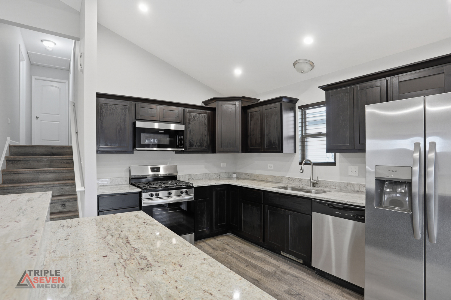 14528 Kolin Avenue Midlothian, IL 60445 - Photo 11 of 29 a kitchen with stainless steel appliances granite countertop a sink stove and refrigerator