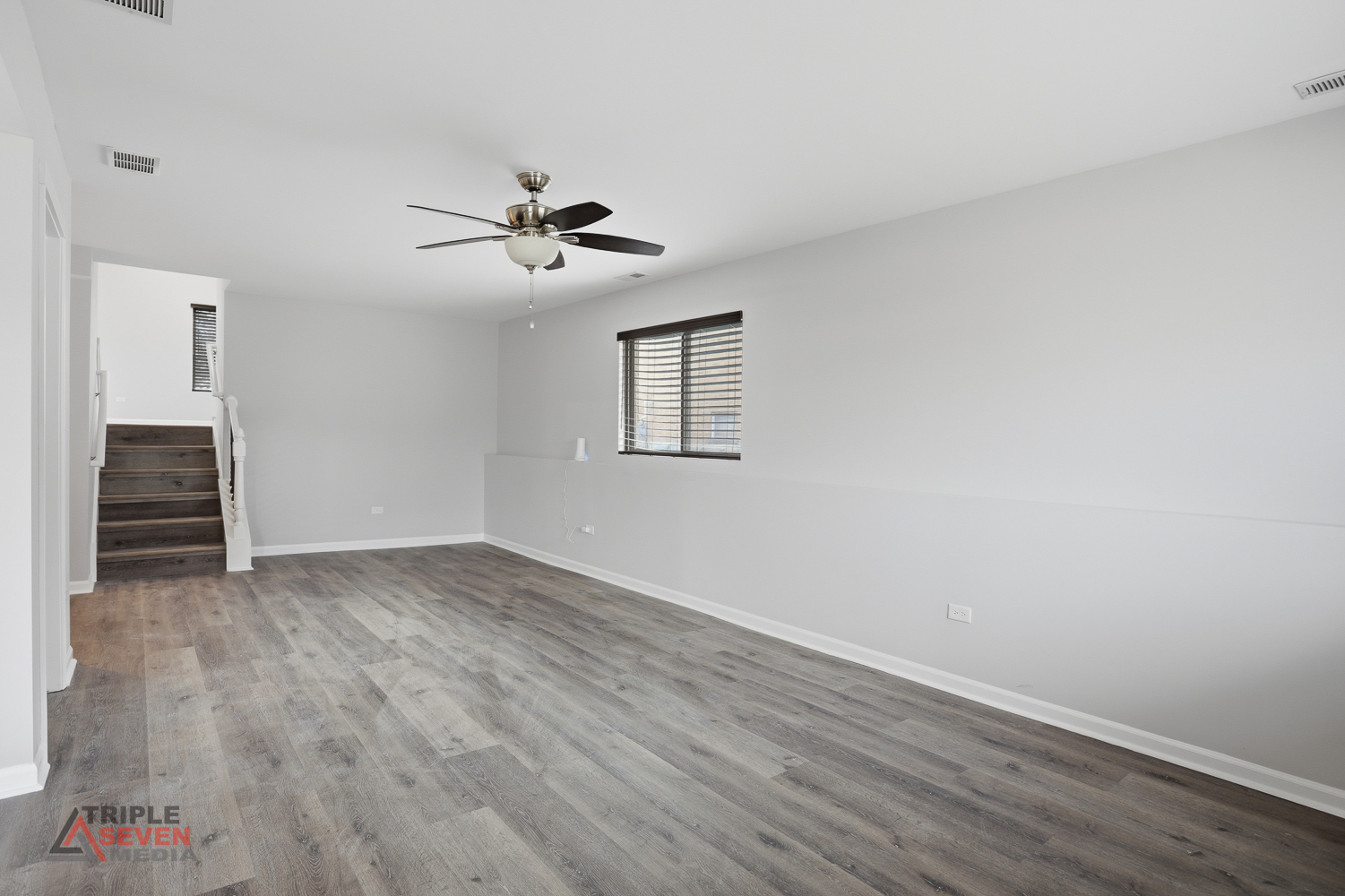 14528 Kolin Avenue Midlothian, IL 60445 - Photo 24 of 29 a view of empty room with wooden floor and ceiling fan