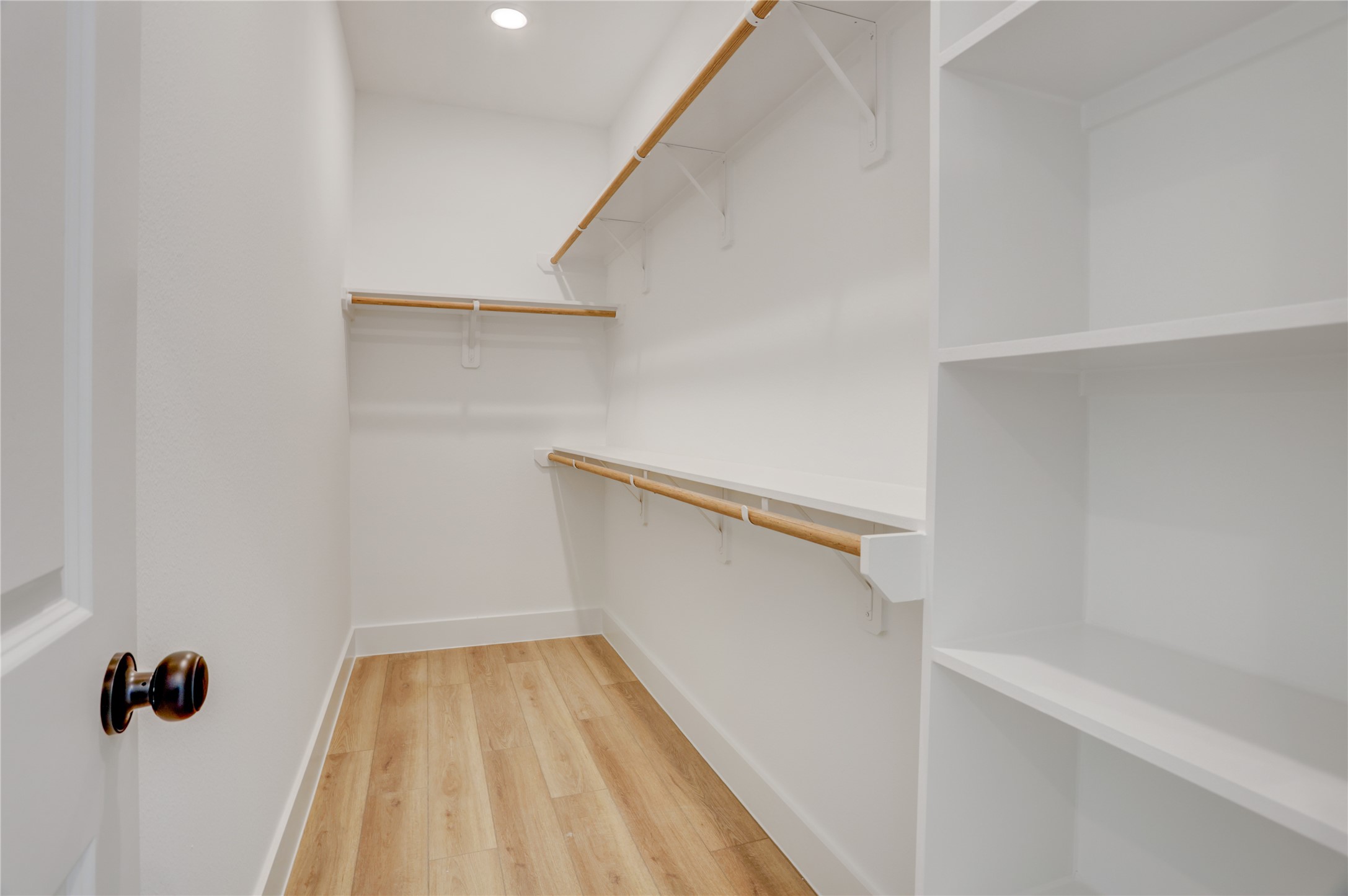 9604 Burden Street Houston, TX 77093 - Photo 21 of 28 The primary bedroom has an enormous walk in closet with built ins.