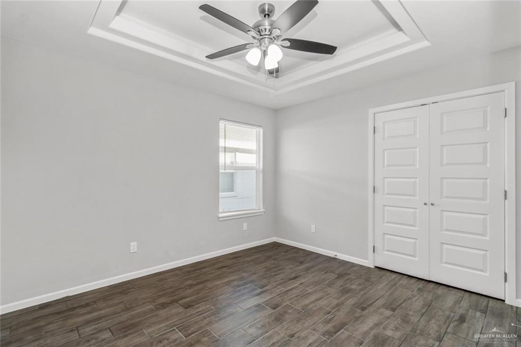2011 Stardust Lane, Unit 4 Edinburg, TX 78541 - Photo 6 of 10 wooden floor in an empty room with a window