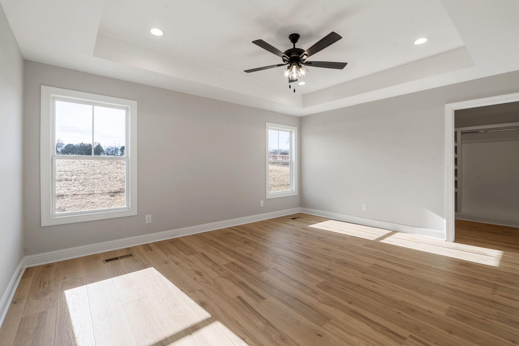 8184 Gideon Road Greenbrier, TN 37073 - Photo 17 of 25 an empty room with wooden floor and windows