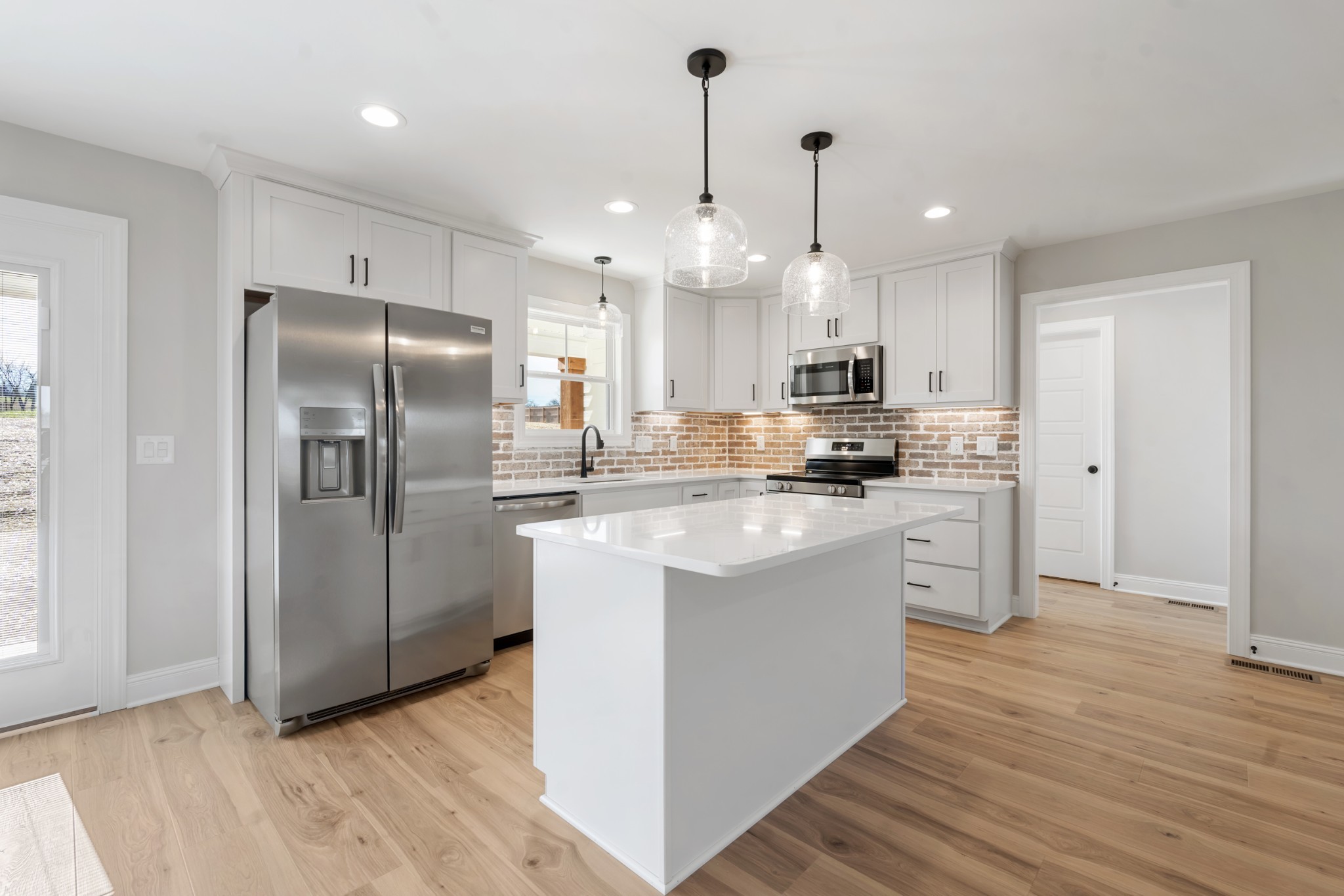 8184 Gideon Road Greenbrier, TN 37073 - Photo 9 of 25 a kitchen with stainless steel appliances granite countertop a refrigerator a sink a stove and a oven