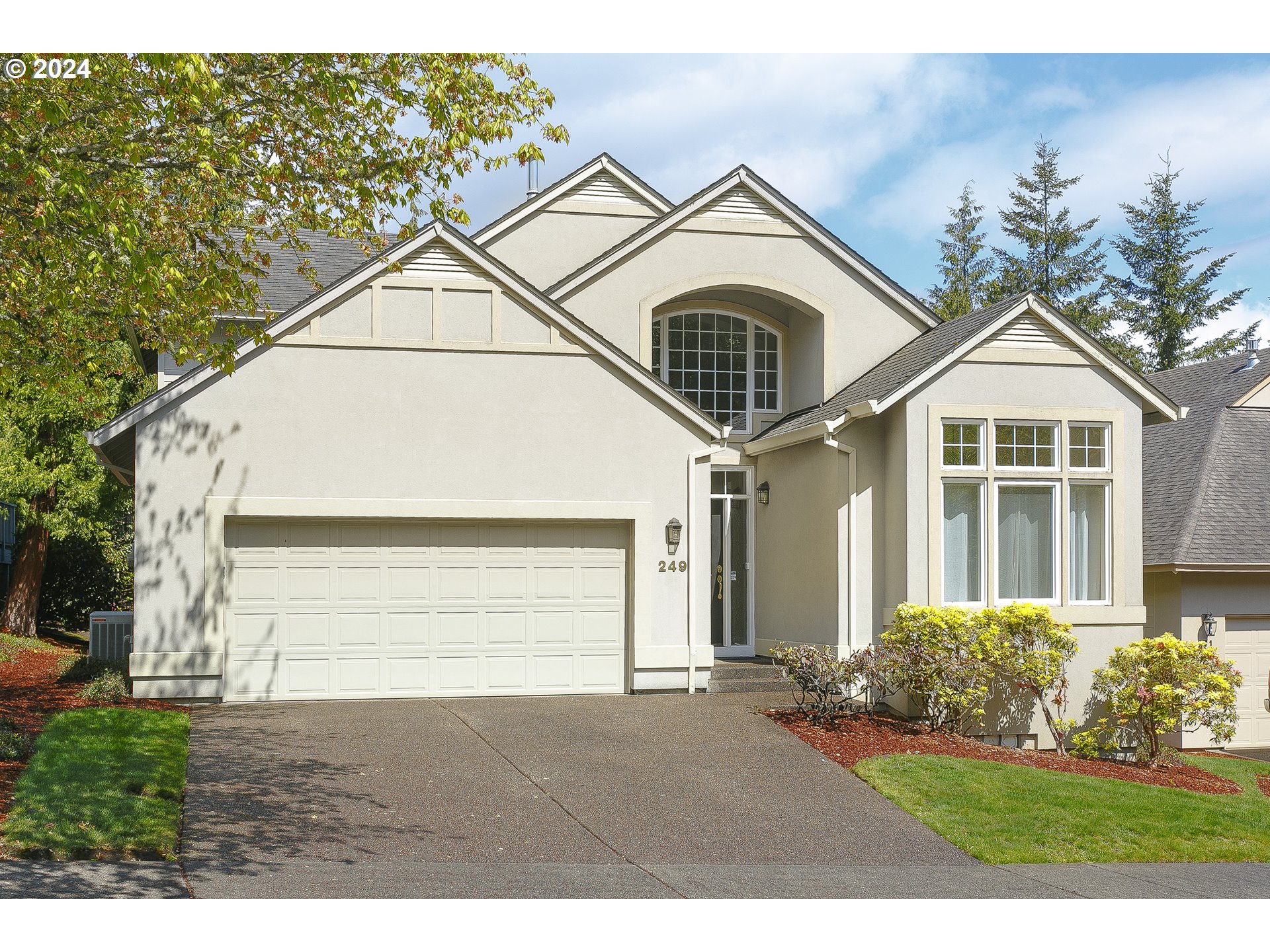249 Southeast 46th Drive Gresham, OR 97080 - Photo 1 of 22 a view of a white house next to a yard