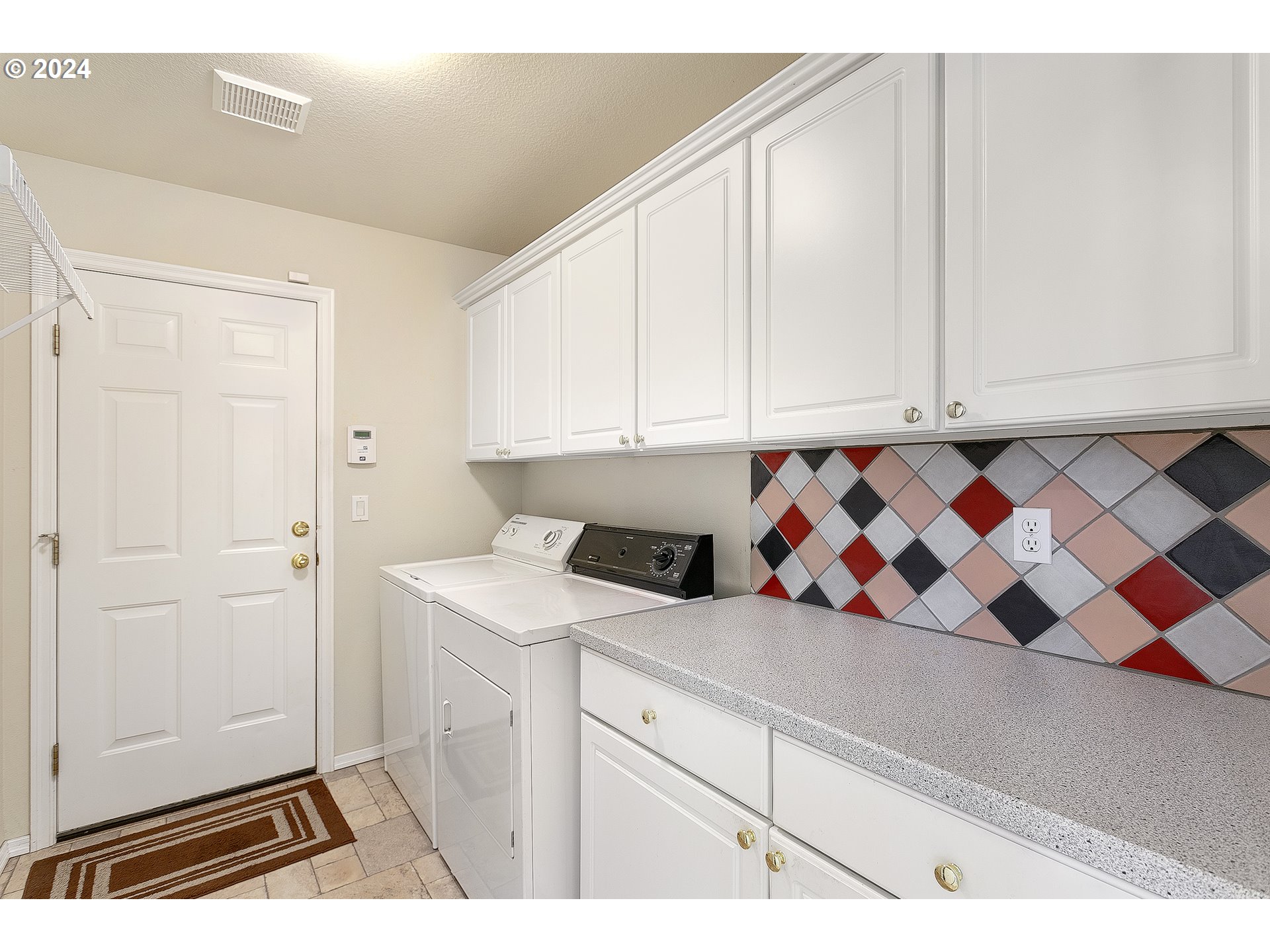 249 Southeast 46th Drive Gresham, OR 97080 - Photo 11 of 22 a view of a kitchen with white cabinets