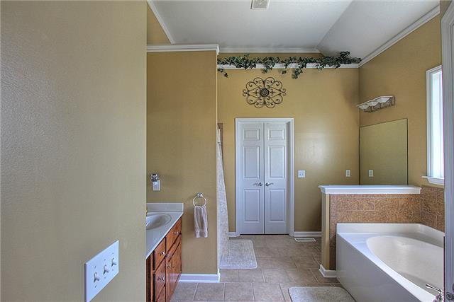 975 Rip Steele Road Columbia, TN 38401 - Photo 11 of 20 The master bath features a separate tub and shower as well as double vanities. There is also a large walk-in closet.