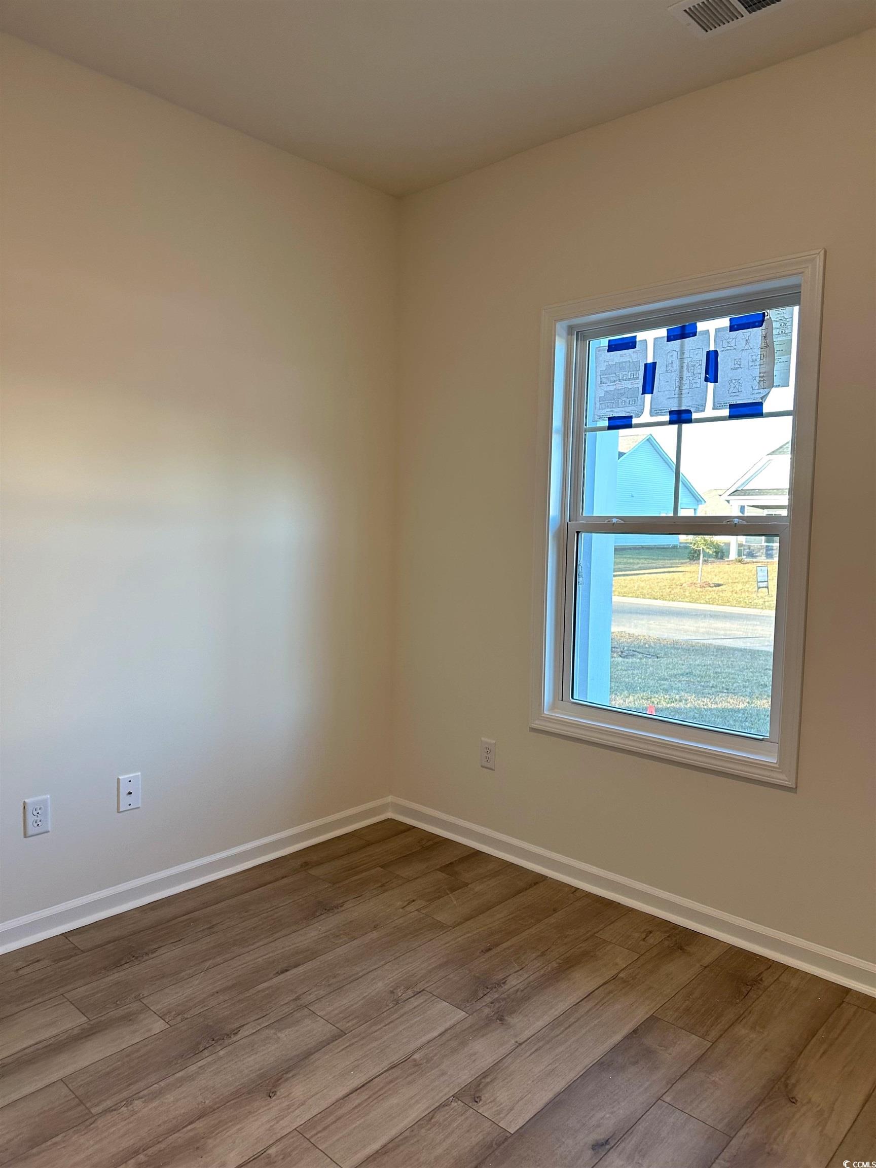 892 Birch Gdn Drive Longs, SC 29568 - Photo 11 of 15 Unfurnished room with baseboards and wood finished floors