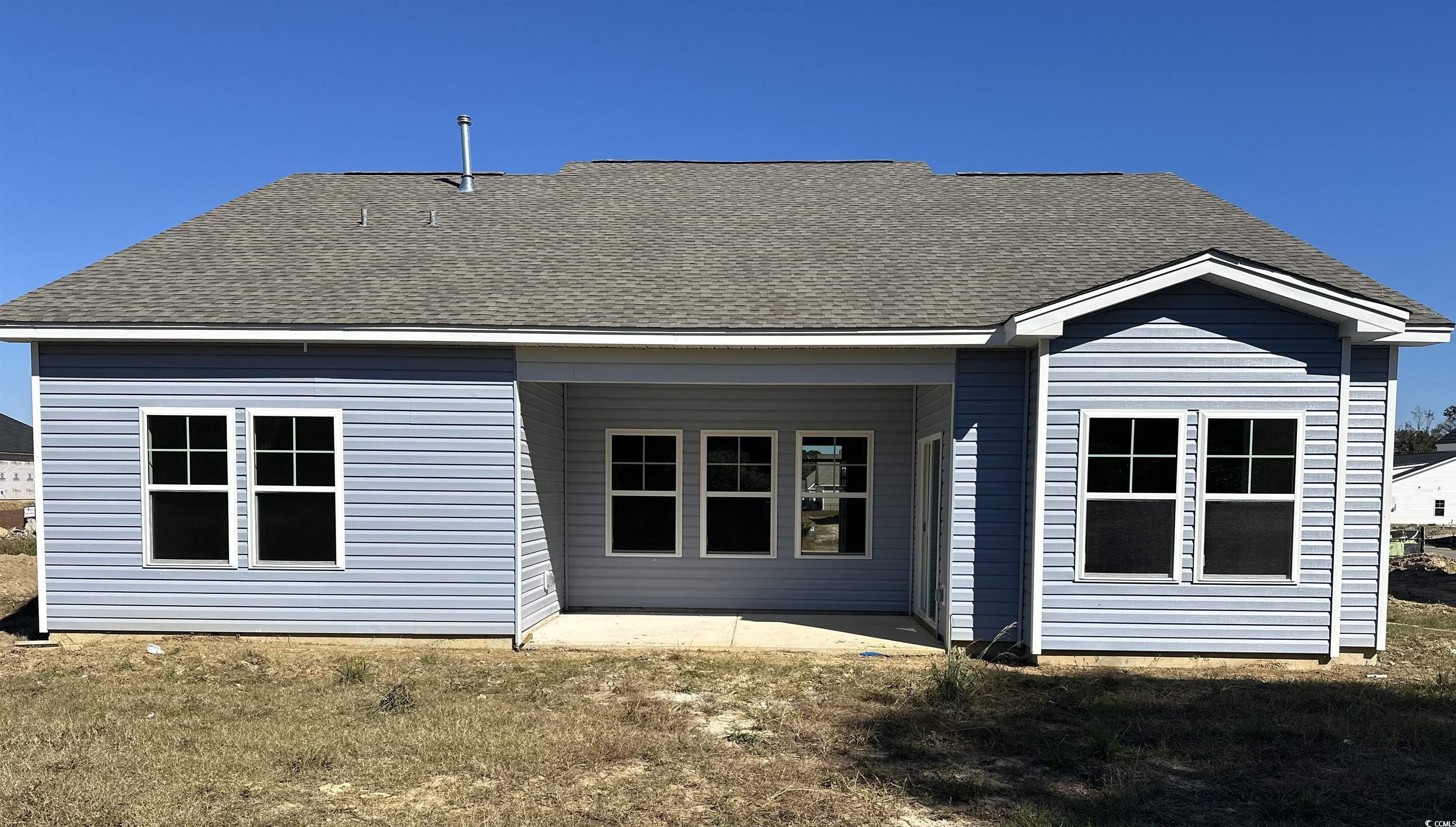 892 Birch Gdn Drive Longs, SC 29568 - Photo 13 of 15 Rear view of property featuring a patio, roof with shingles, and a lawn