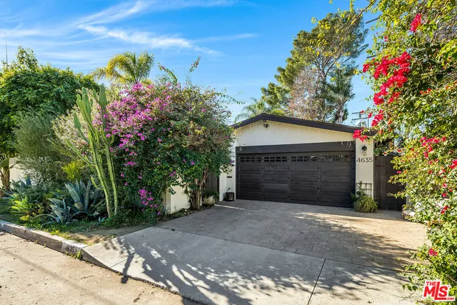 a front view of a house with a garage