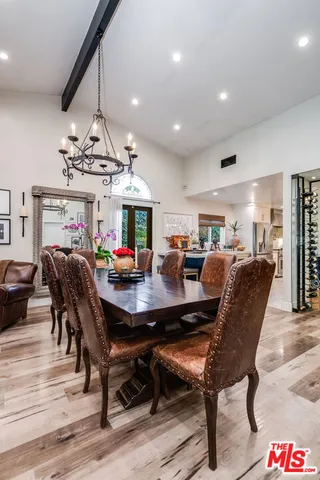 a kitchen with a stove a sink and cabinets
