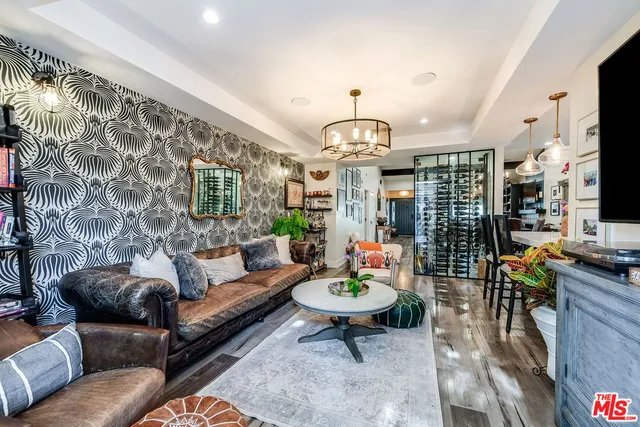 a bedroom with furniture and a flat screen tv