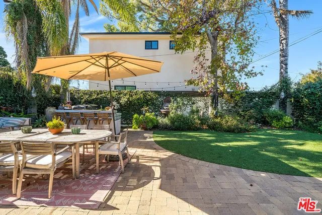 a backyard of a house with seating space