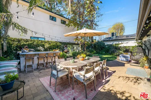 an aerial view of a house with outdoor space
