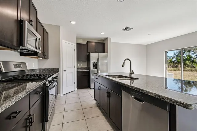 a view of an empty room with glass door