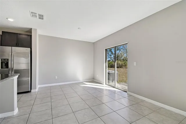 a bathroom with a granite countertop sink a toilet a shower and a mirror