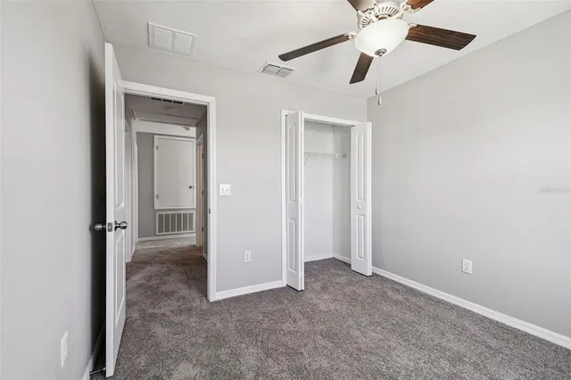 an aerial view of residential houses with outdoor space and lake view