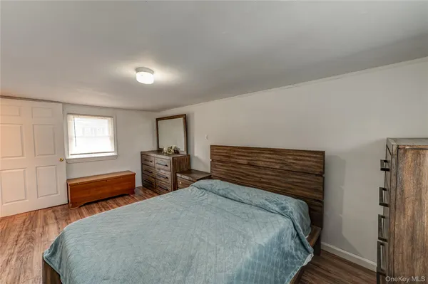 a bedroom with a bed and a closet
