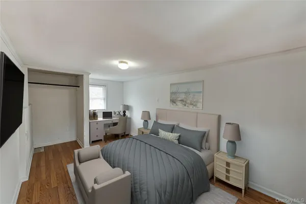 a bedroom with a bed and a couch