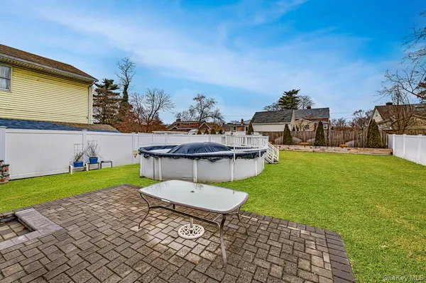 a view of a backyard with sitting area
