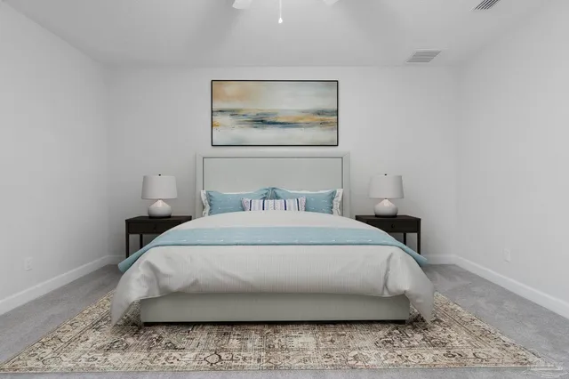 a large bed sitting in a bedroom next to a rug