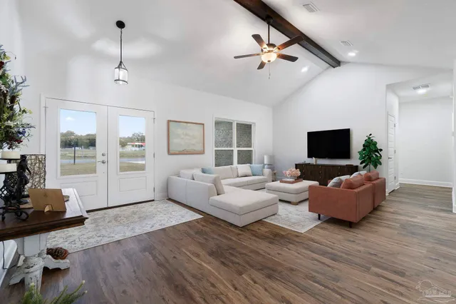 a living room with furniture and a flat screen tv