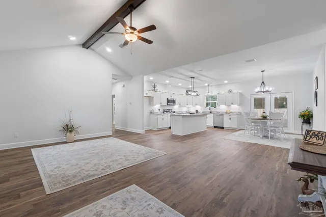 a living room with kitchen island furniture and a wooden floor