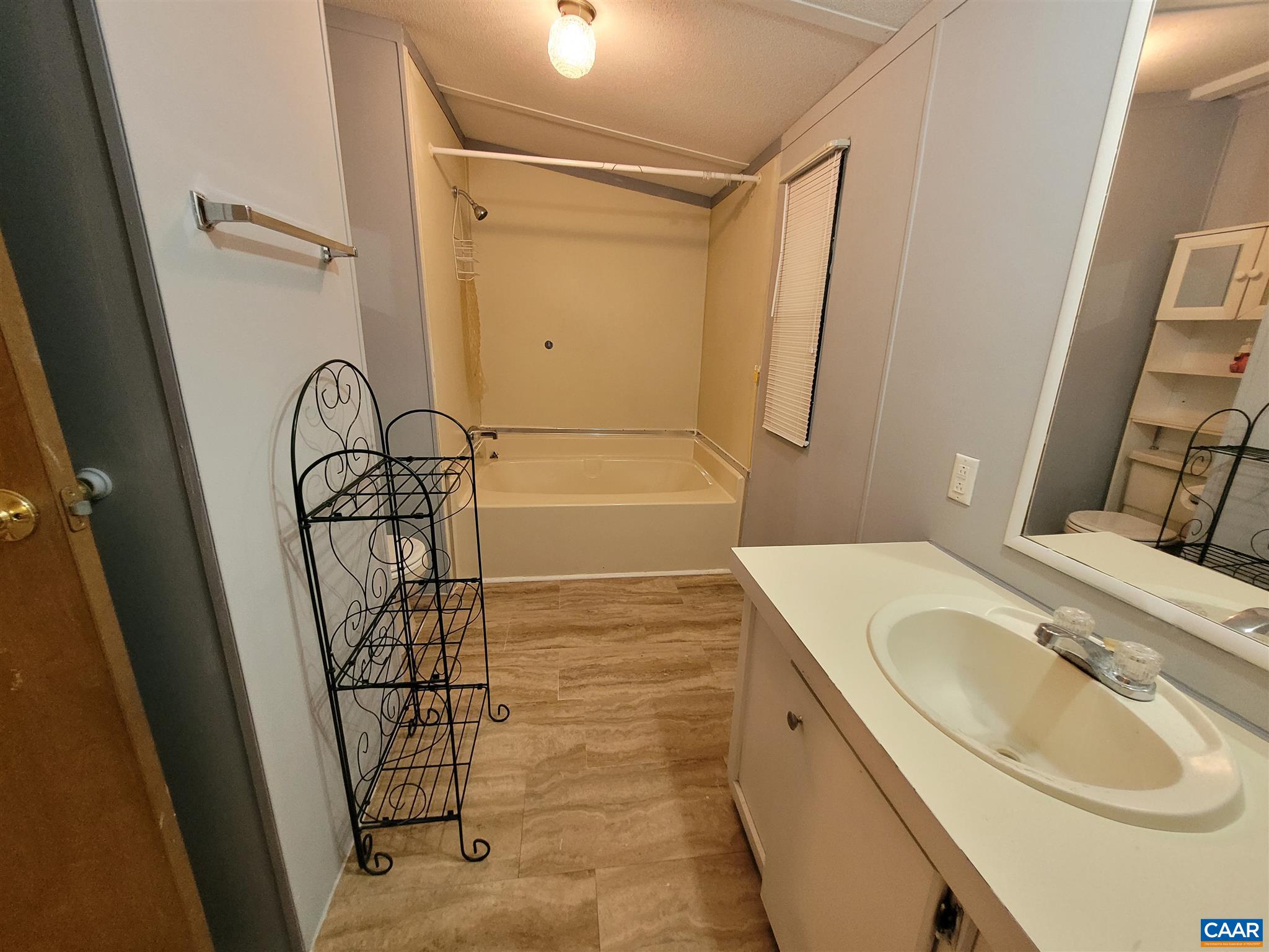 2888 Nelsons Road Esmont, VA 22937 - Photo 8 of 20 a bathroom with a sink a toilet and shower