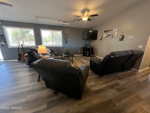 a spacious bathroom with a double vanity sink and a mirror