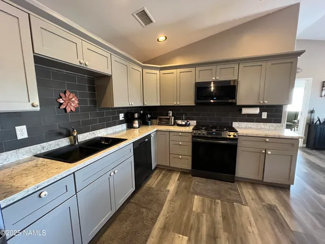 a bedroom with a bed couch and window
