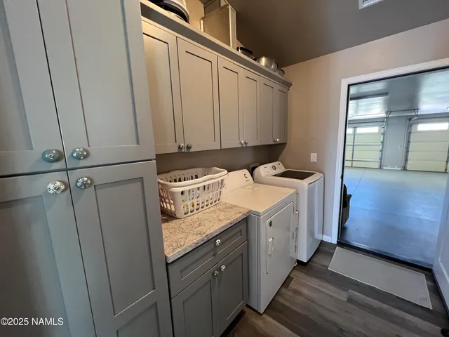 an aerial view of house with yard and mountain view in back