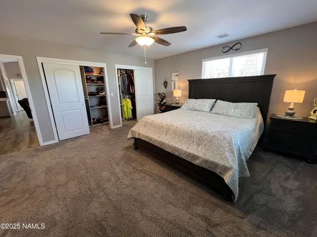 a view of a outdoor space with green field and mountains