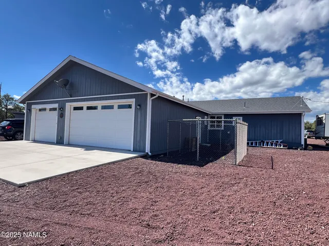 a view of a two chairs in the patio