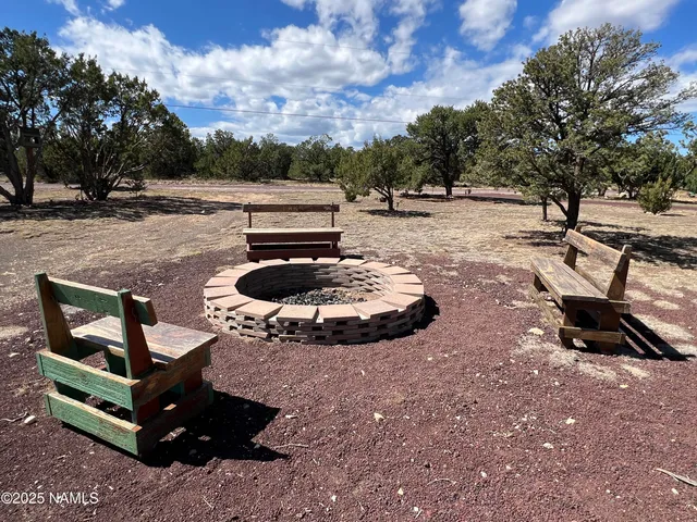 a living room with furniture ceiling fan and a window