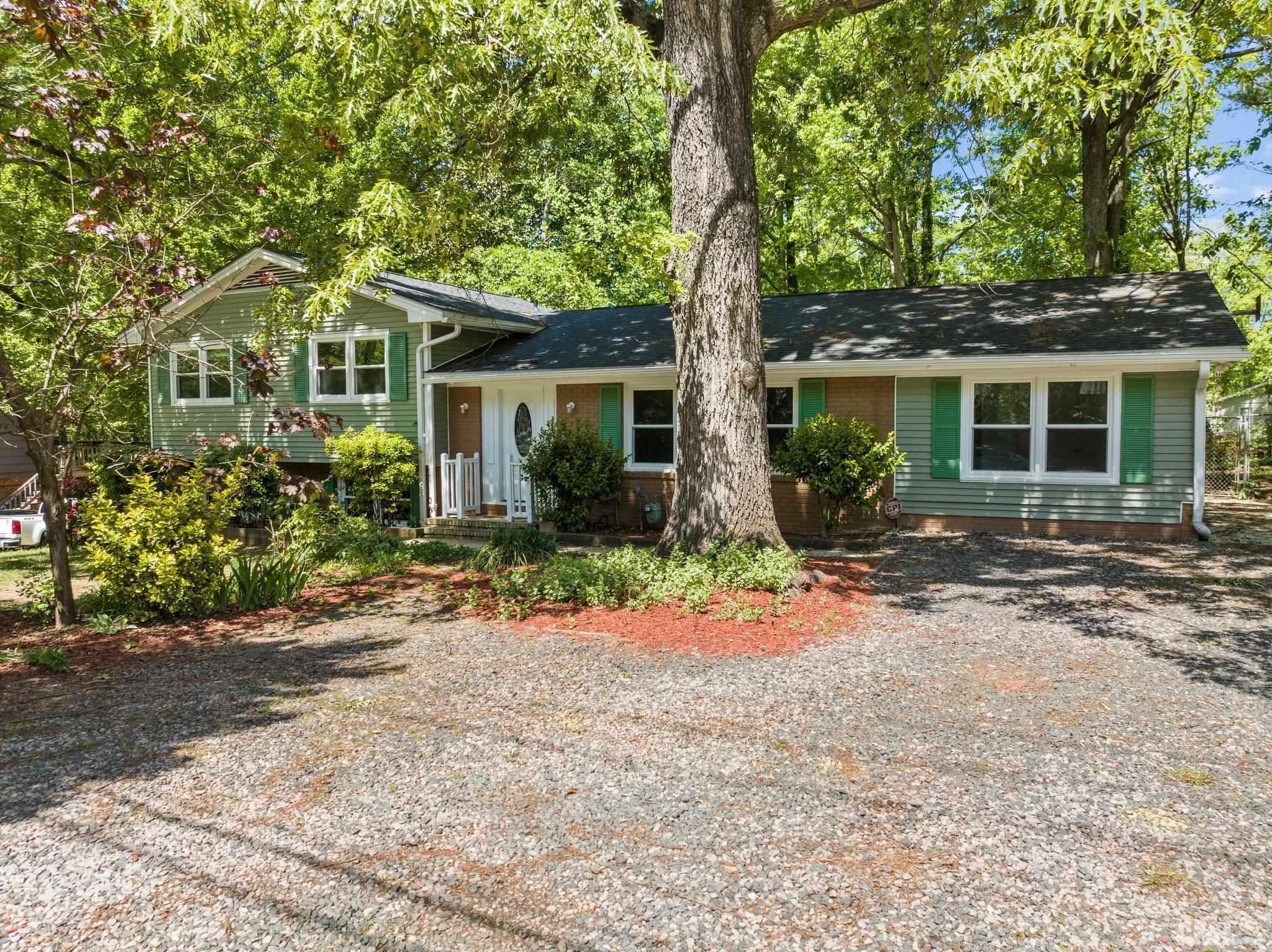607 Southeast Maynard Road Cary, NC 27511 - Photo 2 of 3 a front view of a house with garden