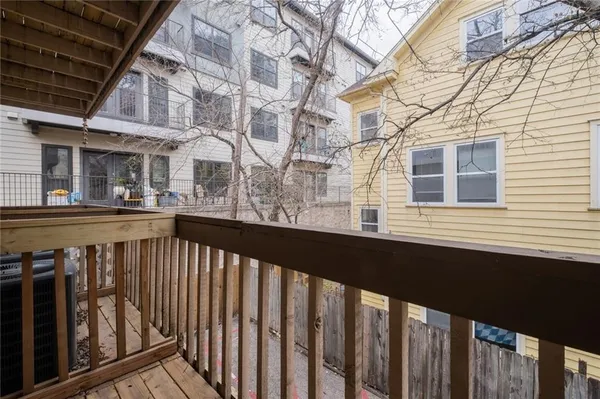 a view of a balcony with car parked