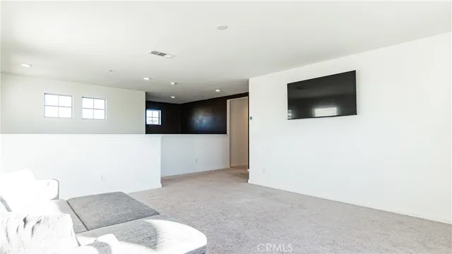 a view of a livingroom with a flat screen tv