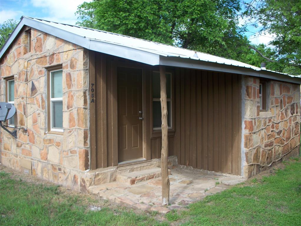 705 South Street, Unit A Graham, TX 76450 - Photo 2 of 7 a backyard of a house