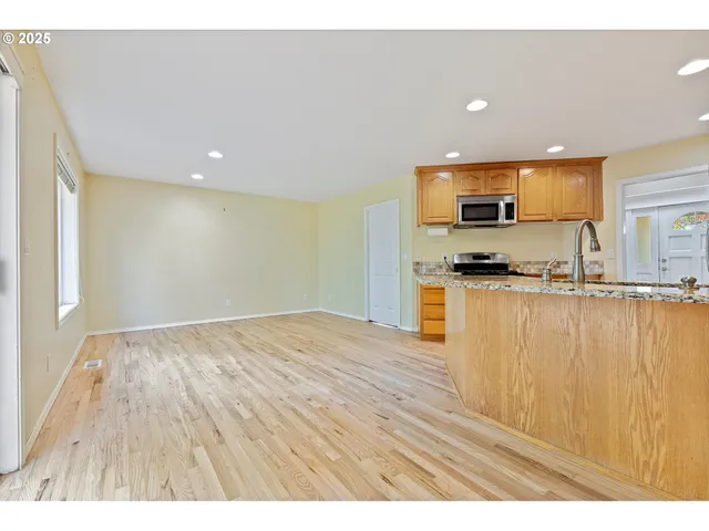 a view of kitchen with wooden floor