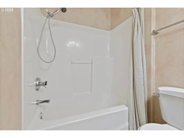 a bathroom with a bath tub and a shower