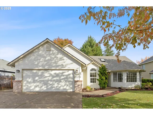 a view of house with yard