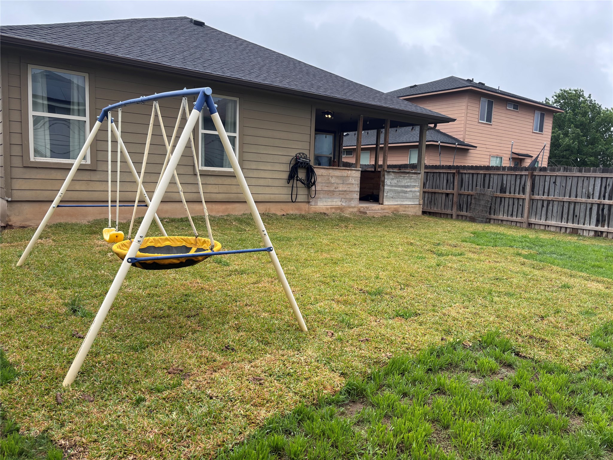 606 Old Peak Road Georgetown, TX 78626 - Photo 17 of 23 a view of a house with a backyard and a wooden floor
