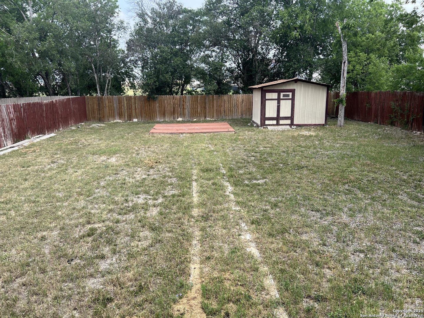 111 Rene Avenue San Antonio, TX 78233 - Photo 9 of 15 a backyard of a house with deck and wooden fence
