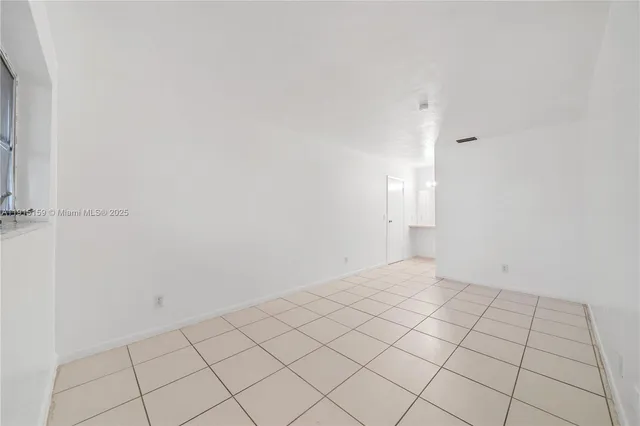 a view of an empty room and window